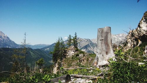 Scenic view of mountains against clear blue sky