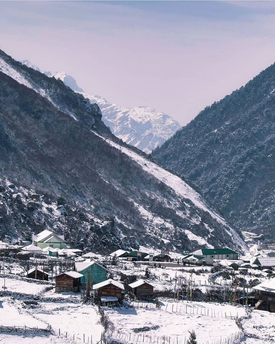 snow, mountain, cold temperature, winter, scenics - nature, environment, landscape, mountain range, beauty in nature, architecture, nature, building, building exterior, built structure, house, land, travel destinations, sky, travel, village, snowcapped mountain, no people, residential district, tranquility, outdoors, tourism, piste, valley, day, tranquil scene, rural scene, non-urban scene, ice, pinaceae, holiday, vacation, frozen, tree