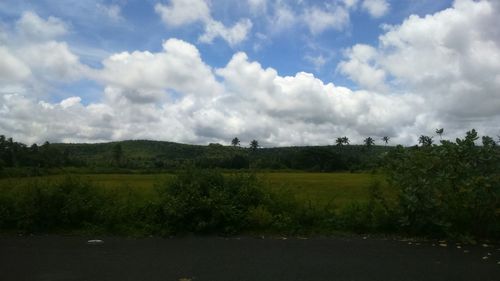 Scenic view of landscape against cloudy sky