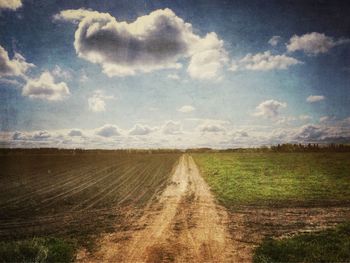 Road passing through field
