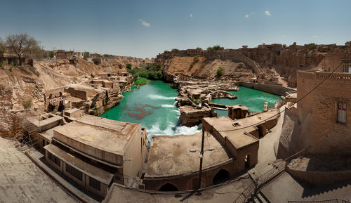 Shushtar historical hydraulic system with old houses constructions around, complex irrigation system