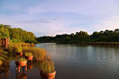 Scenic view of lake against sky during sunset