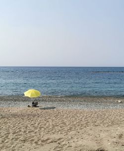 Scenic view of beach against clear sky