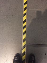 Low section of yellow shoes