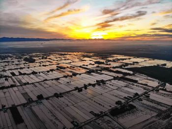 High angle view of sea against sky during sunset