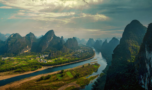 Scenic view of mountains against sky during sunset