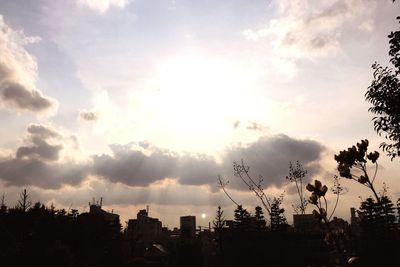 Clouds over city at sunset