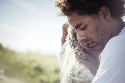 Close-up of couple embracing