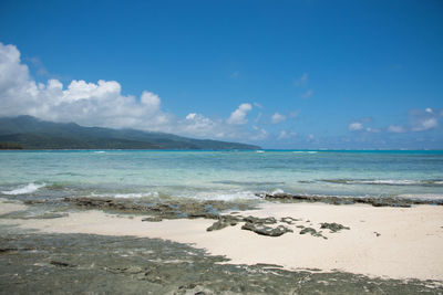 Scenic view of sea against blue sky