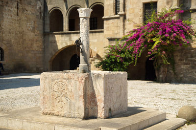 Fountain in a courtyard of an ancient palace in rhodos in greece