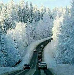 Road passing through snow covered mountain