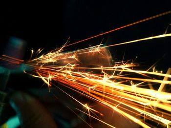 Light trails against sky at night