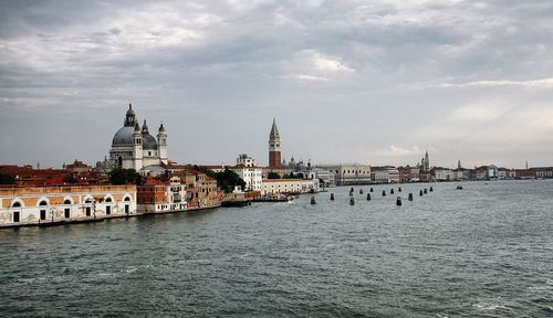 View of buildings against cloudy sky