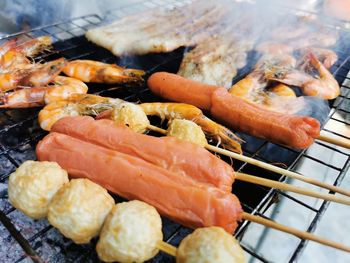 Close-up of meat on barbecue grill