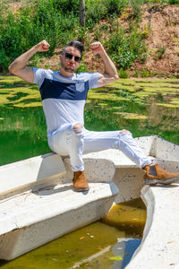 Full length of young man wearing sunglasses