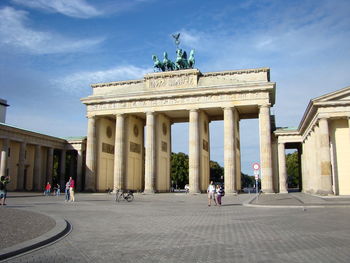 Group of people in front of historical building