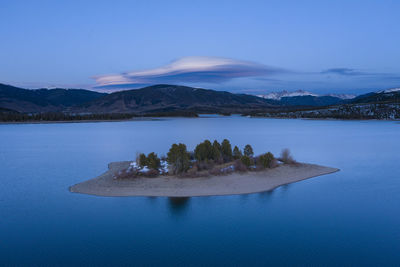 Scenic view of lake against blue sky