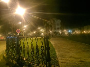 Illuminated building against sky at night