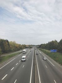 Cars on highway against sky