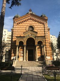 Facade of historic building against sky