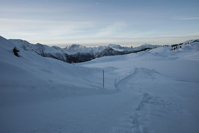 Scenic view of snow mountains against sky