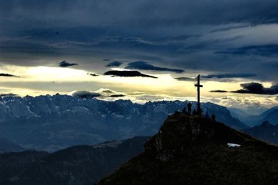 Scenic view of snowcapped mountains against sky during sunset