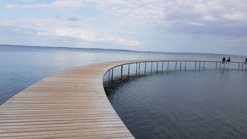 Pier over sea against sky