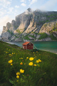 Scenic view of sea and mountains against sky