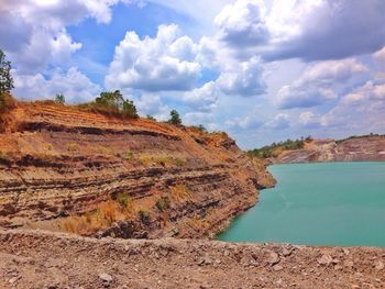 Scenic view of landscape against cloudy sky