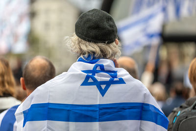 Rear view of man standing in city