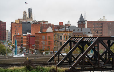 Buildings in city against sky