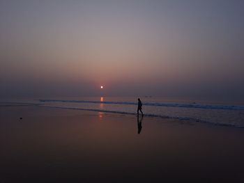 Scenic view of sea against sky during sunset, 