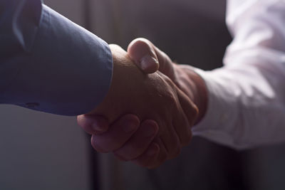 Close-up of man holding hands
