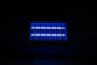 Illuminated window in dark room