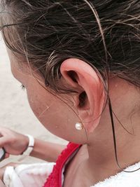 Close-up of wet young woman at beach