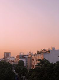 Buildings against sky during sunset