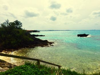 Scenic view of sea against cloudy sky