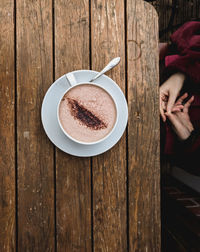 Directly above shot of coffee cup on table