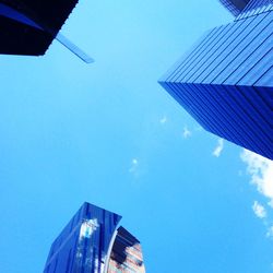 Low angle view of building against blue sky