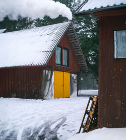 House on snow covered field