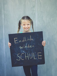 Portrait of a smiling girl with text