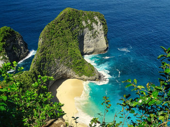 High angle view of rock in sea