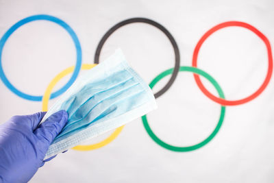 High angle view of person hand against blue background