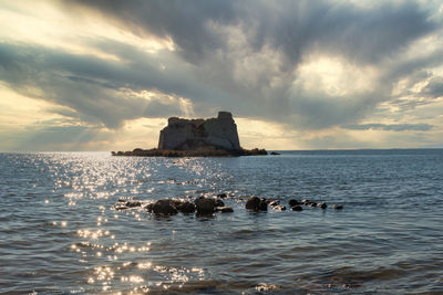 Scenic view of sea against sky at sunset