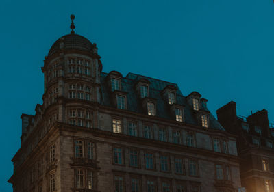 Low angle view of building against blue sky