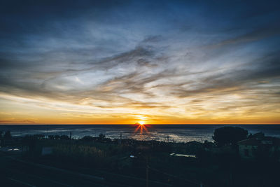 High angle view of sea against sky during sunset