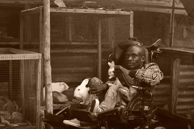 Portrait of cute girl sitting with toy toys