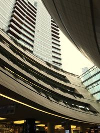 Low angle view of modern buildings against sky in city