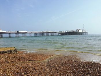 Pier over sea against sky