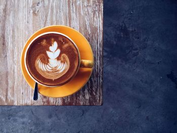 Directly above shot of coffee cup on table